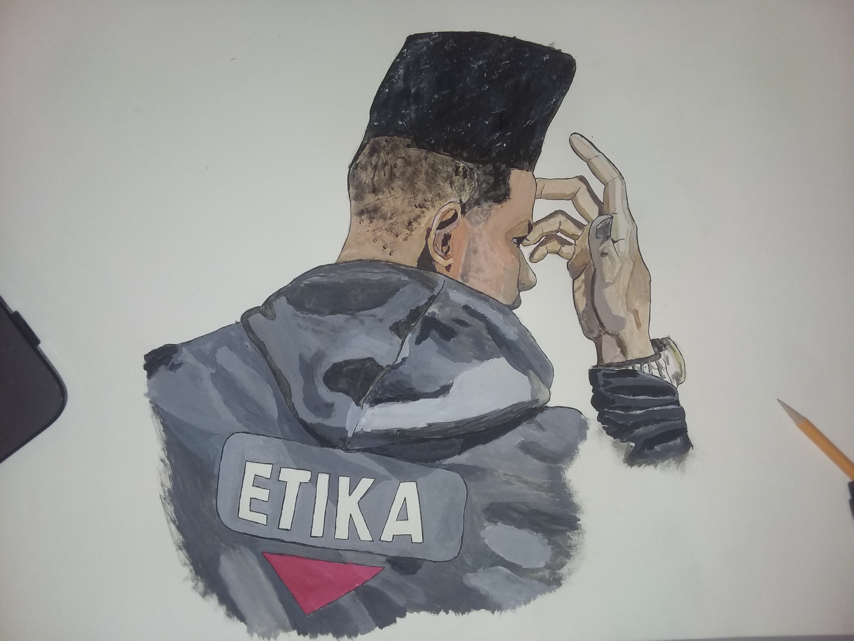 man in jacket that says etika