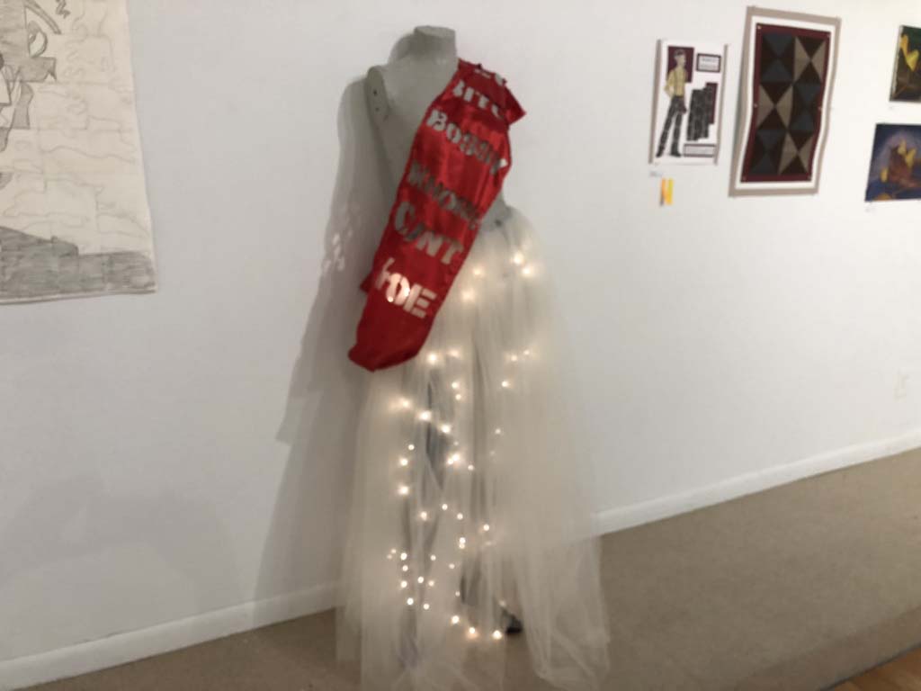wedding dress with lighted skirt and sash with laser-cut words