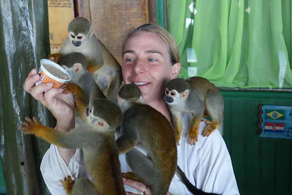 photo of monika espinasa with several monkeys