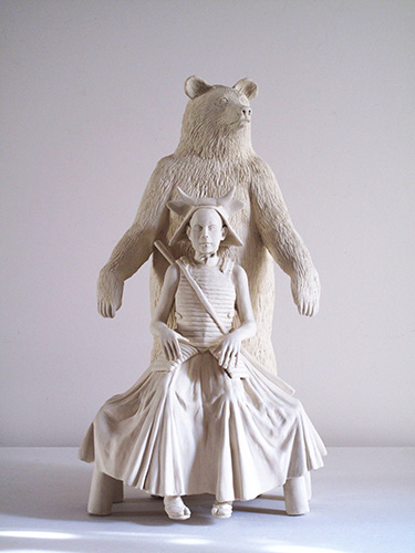 sculpture by ursula cline of bear and warrior in horned bull helmet