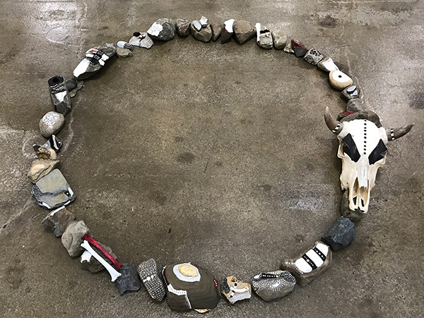 art mad eof rocks and skulls arranged in a circle