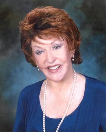 portrait of Darlene Pfeiffer, woman smiling wearing pearls