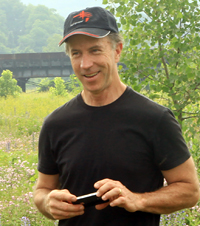 photo of Rick Darke, man in baseball cap in nature